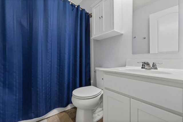 full bathroom featuring toilet, vanity, and shower / bathtub combination with curtain