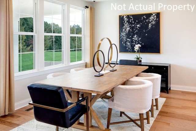 dining area with light hardwood / wood-style floors