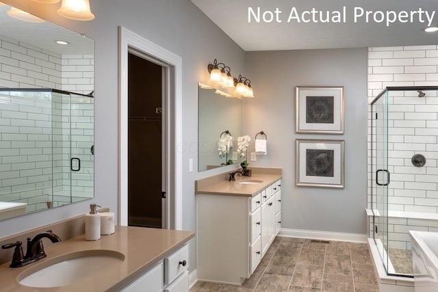 bathroom featuring vanity and a shower with door