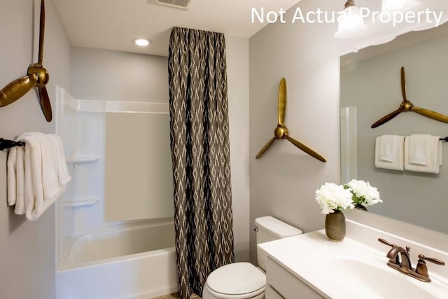 full bathroom featuring vanity, shower / bath combo with shower curtain, and toilet