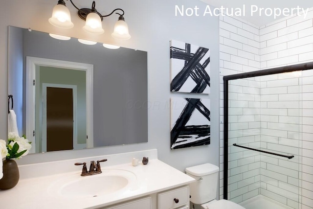 bathroom with vanity, a shower with shower door, a chandelier, and toilet