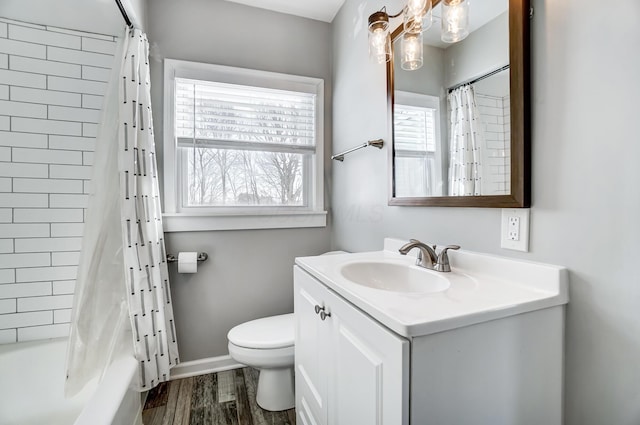 full bathroom with toilet, vanity, shower / bath combo, wood-type flooring, and plenty of natural light