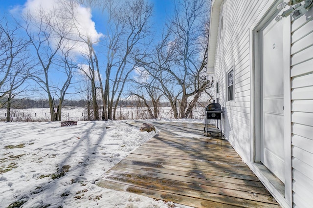 snow covered deck with area for grilling