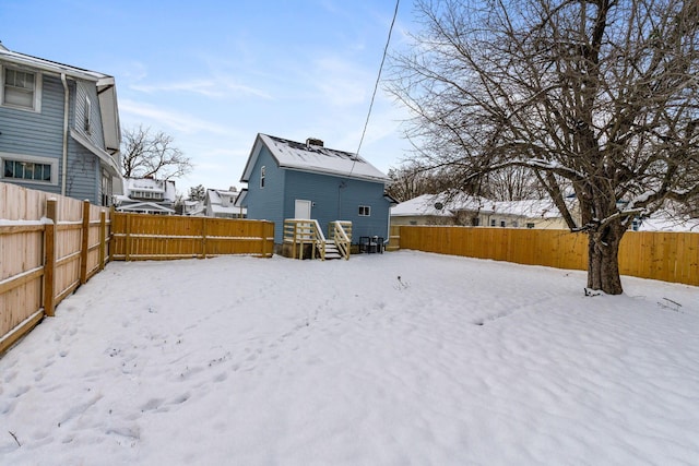 view of yard covered in snow