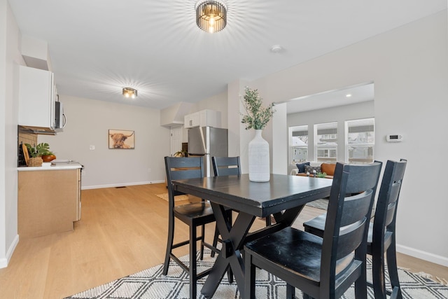 dining room featuring light hardwood / wood-style flooring