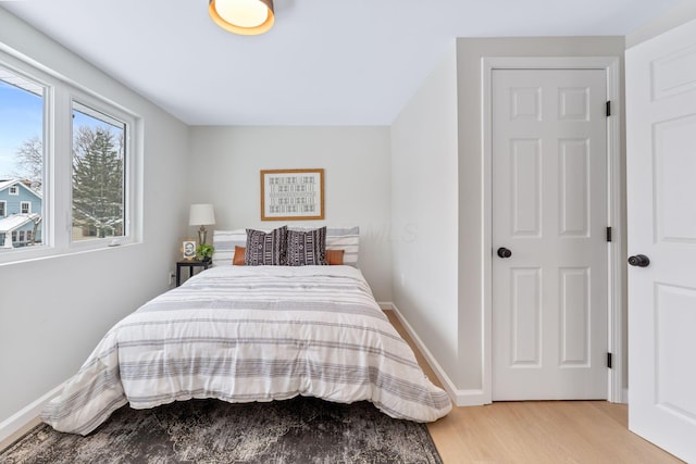 bedroom with light wood-type flooring