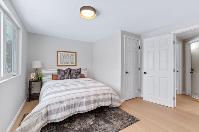 bedroom with light hardwood / wood-style floors