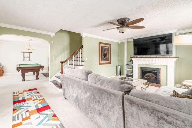 living room featuring crown molding, light carpet, and a textured ceiling