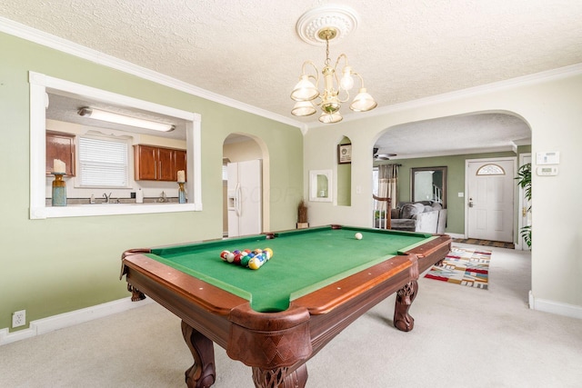 recreation room featuring light carpet, a textured ceiling, ceiling fan, crown molding, and pool table