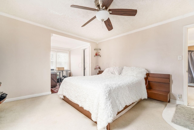 bedroom with carpet flooring, ceiling fan, a textured ceiling, and ornamental molding