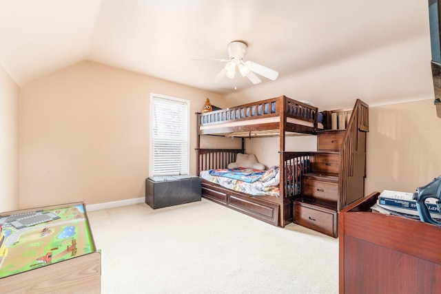 carpeted bedroom featuring vaulted ceiling and ceiling fan