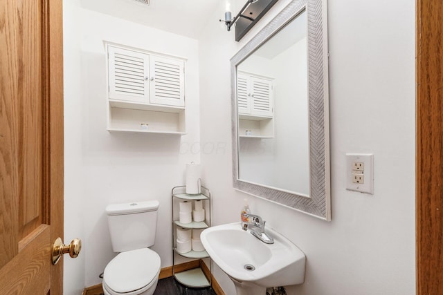 bathroom with toilet and sink