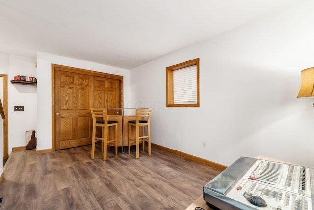 dining room with dark wood-type flooring