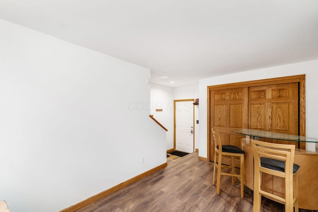 dining space featuring dark hardwood / wood-style flooring