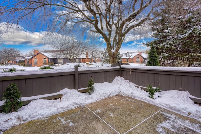 view of yard layered in snow