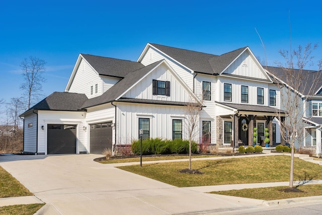 view of front of home featuring driveway, roof with shingles, board and batten siding, a front yard, and a garage