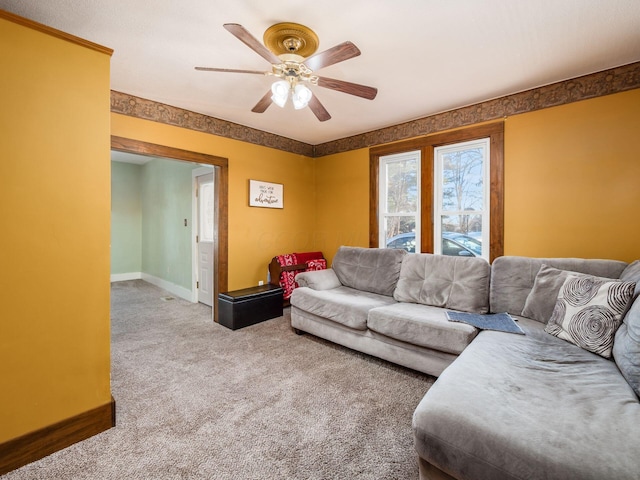 living room with ceiling fan and carpet flooring