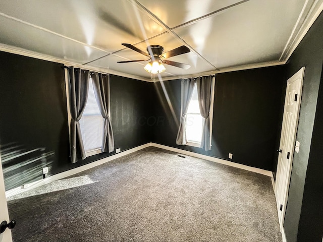 unfurnished room with ceiling fan, carpet floors, and ornamental molding