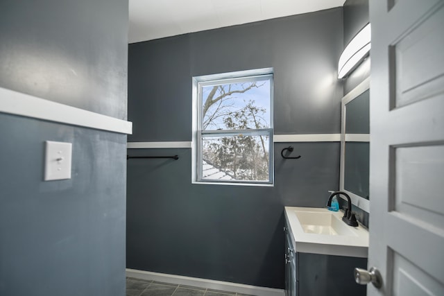 bathroom with tile patterned flooring and vanity