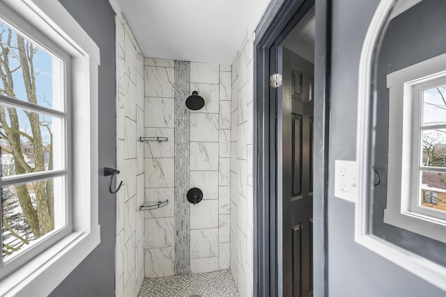 bathroom with a tile shower