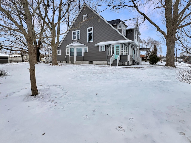 view of snow covered house