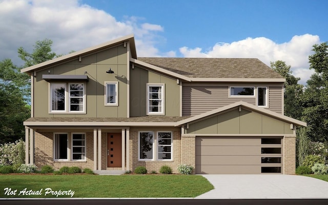 view of front of house with a front yard and a garage