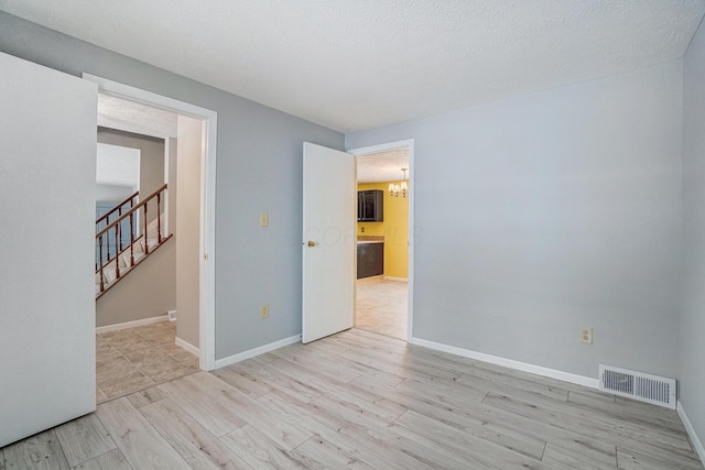 unfurnished room featuring light hardwood / wood-style flooring