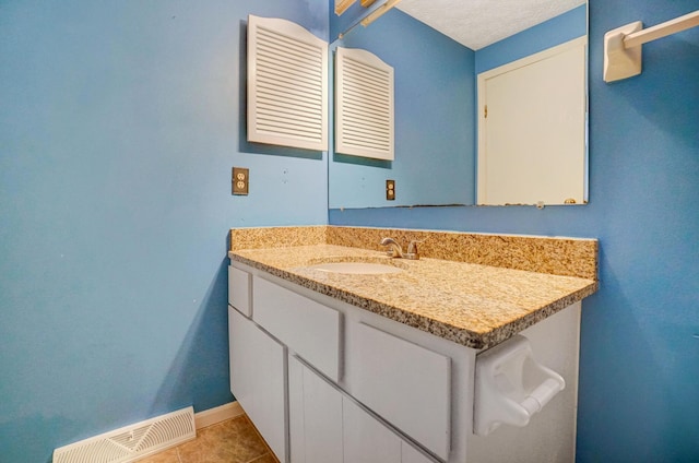 bathroom featuring vanity and tile patterned flooring