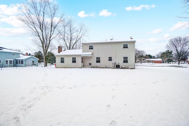 view of snow covered house