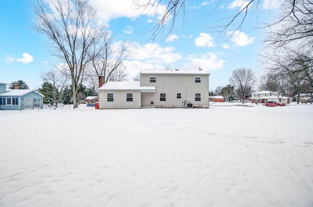 view of snow covered house