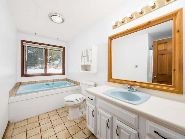 bathroom with toilet, a tub, tile patterned flooring, and vanity