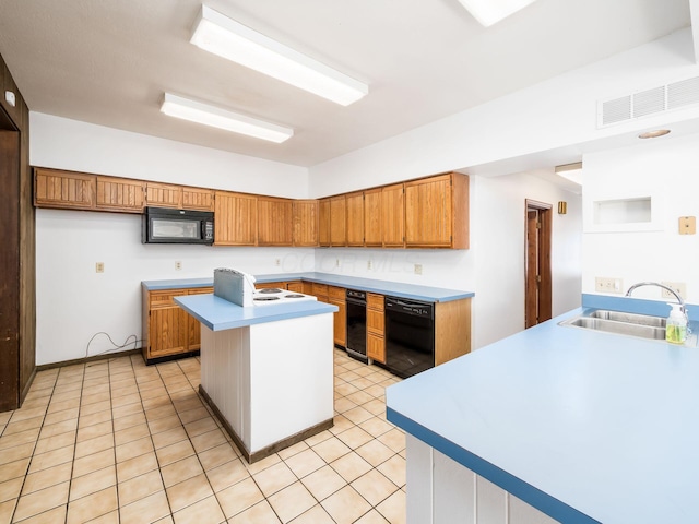 kitchen featuring black appliances, a kitchen island with sink, light tile patterned flooring, and sink