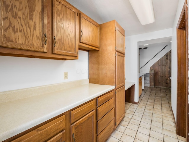 kitchen with light tile patterned flooring