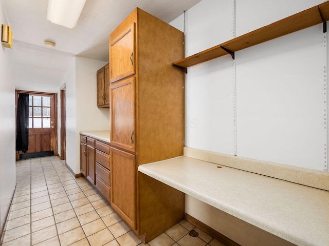 kitchen with light tile patterned floors