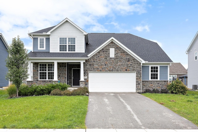 craftsman-style home with a front yard and a garage