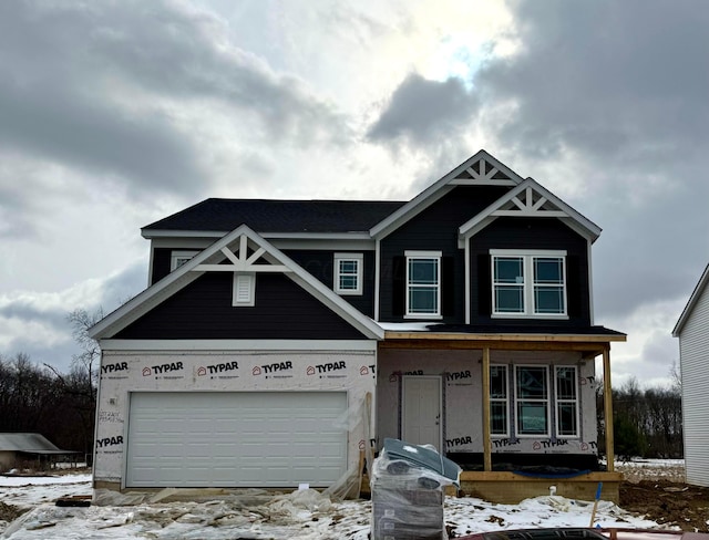 view of front facade with a porch and a garage