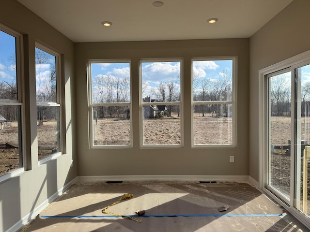 unfurnished sunroom featuring a healthy amount of sunlight