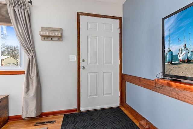 doorway to outside with hardwood / wood-style flooring