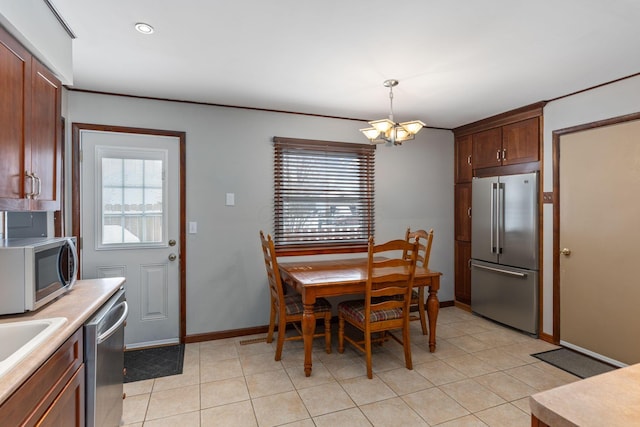 dining area with a chandelier and a healthy amount of sunlight