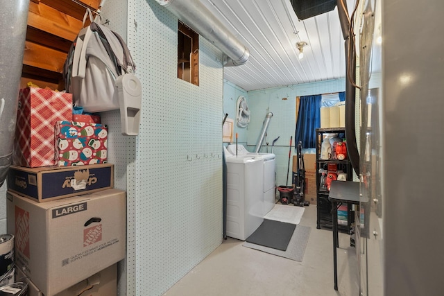 clothes washing area featuring washer / dryer