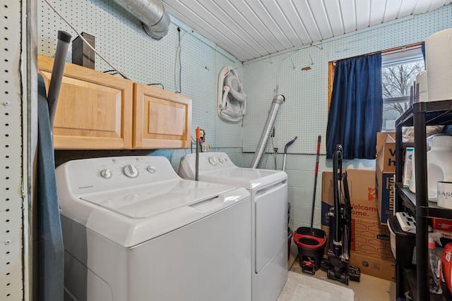 laundry area with cabinets and independent washer and dryer