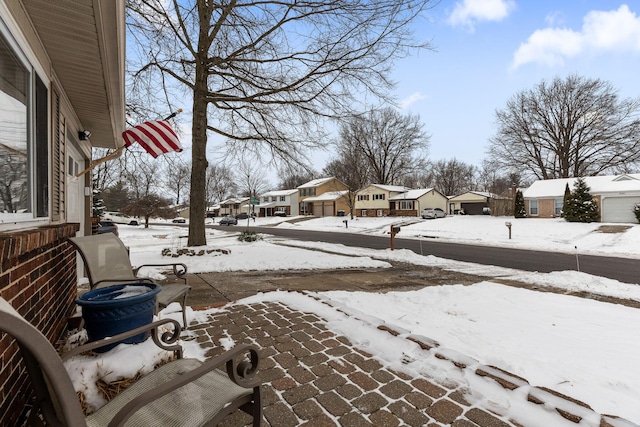 view of yard layered in snow