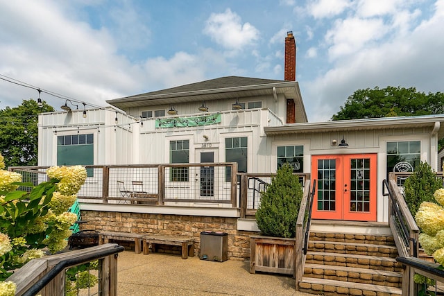 rear view of property featuring french doors