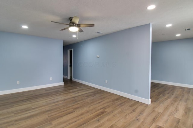 unfurnished room featuring ceiling fan and light wood-type flooring