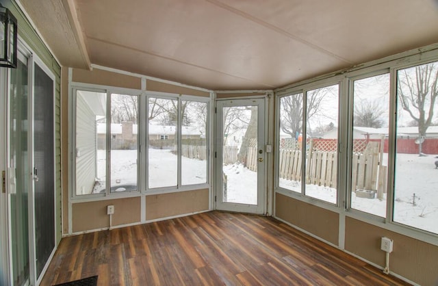 unfurnished sunroom with a healthy amount of sunlight and vaulted ceiling