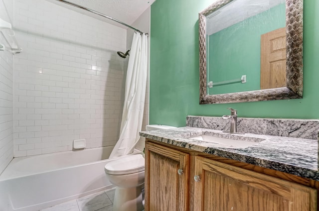 full bathroom with vanity, tile patterned floors, toilet, shower / bath combo with shower curtain, and a textured ceiling