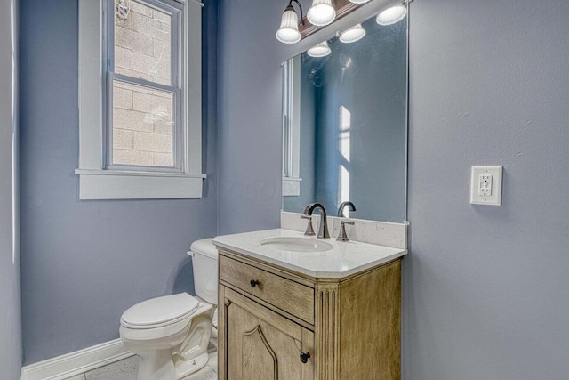 bathroom with toilet and vanity