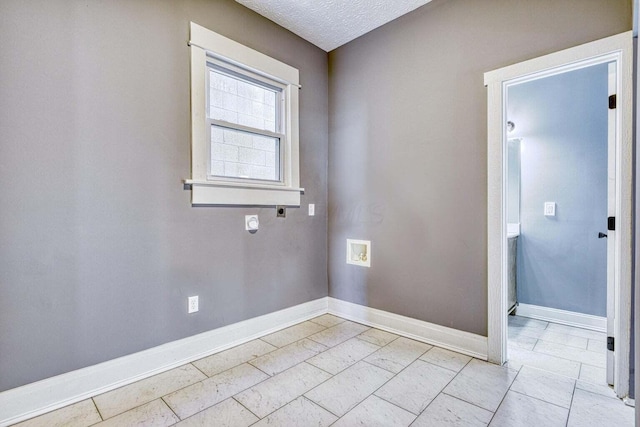 empty room featuring a textured ceiling