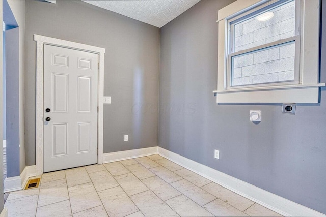 interior space featuring a textured ceiling