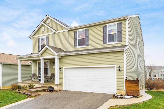 view of front of property featuring a porch and a garage